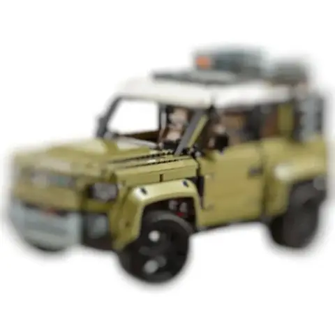 Large-scale, complex build: LEGO Technic-compatible Land Rover Defender off-road vehicle.
